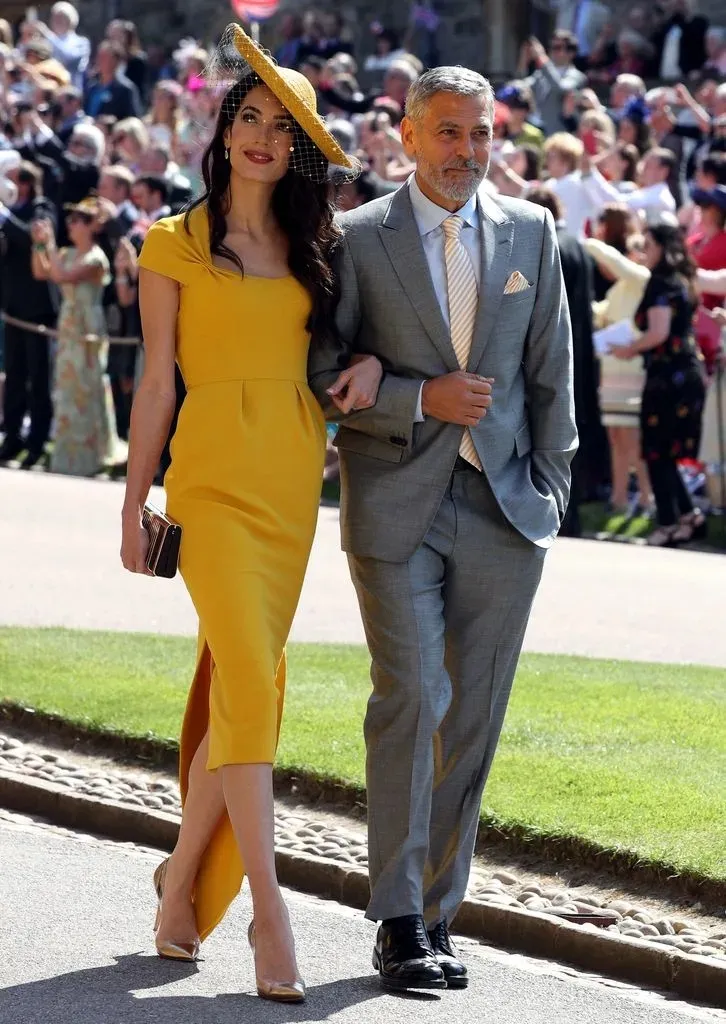 Amal Clooney dazzles in a mini dress while appearing with husband George.