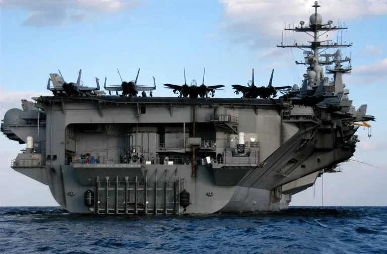 The Nimitz class aircraft carrier USS Harry S. Truman (CVN-75) making her way down the Elizabeth River after departing the Norfolk Naval Shipyard.