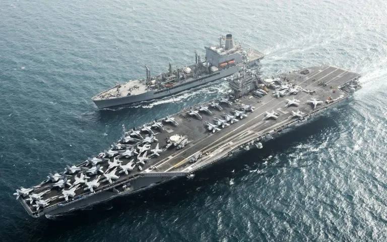 The Nimitz class aircraft carrier USS Harry S. Truman (CVN-75) making her way down the Elizabeth River after departing the Norfolk Naval Shipyard.