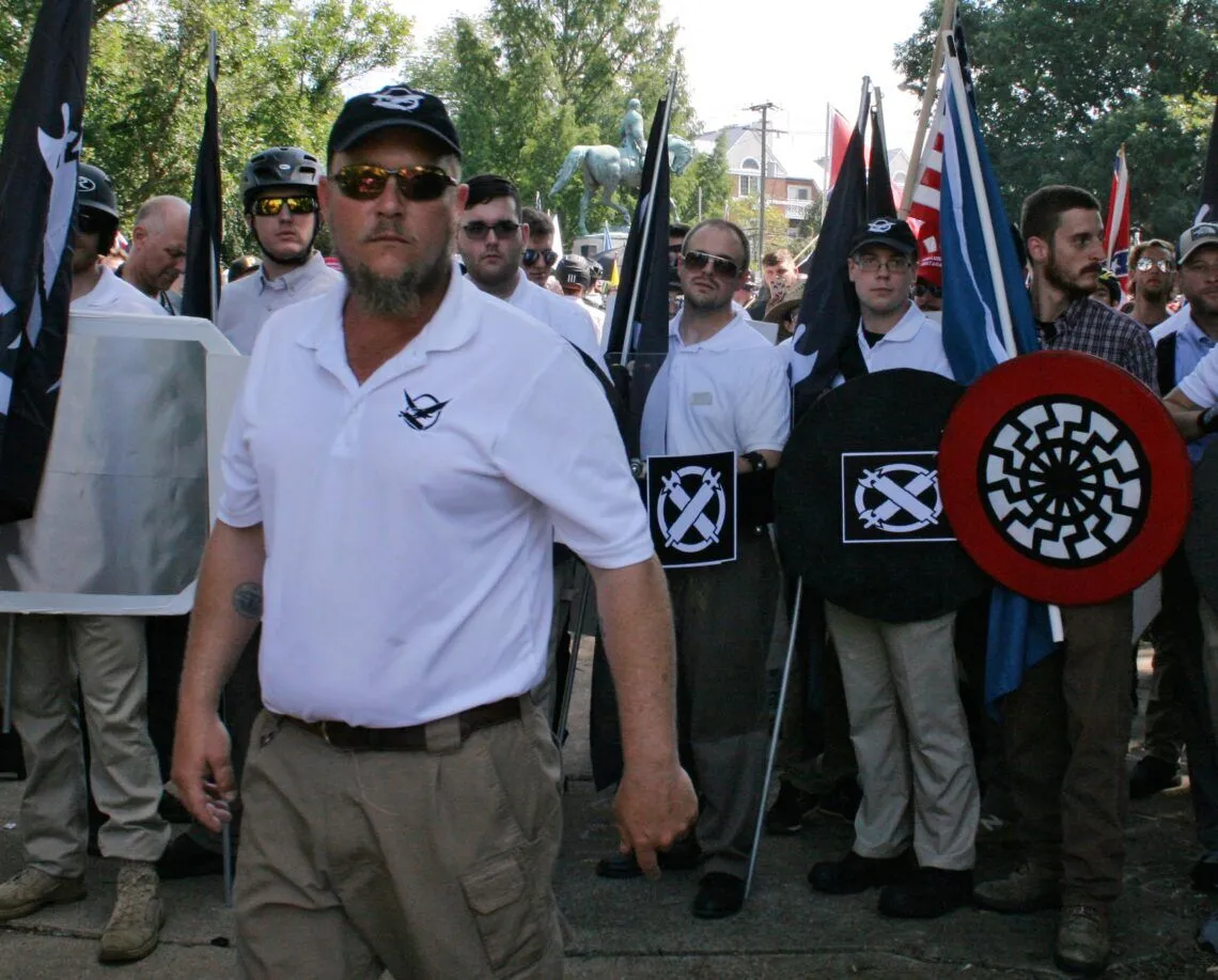 Aug 12, 2017; Charlottesville, VA, USA;  James Fields, Jr. (fourth from right) is seen at the Unite the Right rally. James Fields Jr., 20, is being held on suspicion of second-degree murder, malicious wounding and failure to stop in an accident that resulted in death. Mandatory Credit: Alan Goffinski-USA TODAY NETWORK