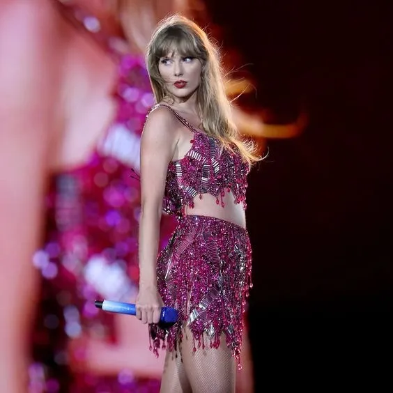 In Maroon Grown, Taylor Swift Exudes Elegance As A Bridesmaid