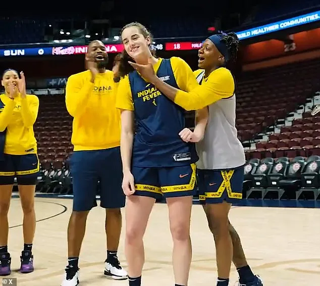 Teammates quickly swarmed Clark, who seemed to be expecting the WNBA honor