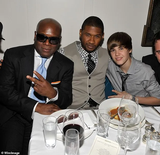 Reid wrote in his tell-all memoir about his first interaction with Justin, who according to the music producer has a 'beautiful' face, trendy hair and natural charisma. Pictured: Bieber with L.A Reid (left) and Usher in 2010