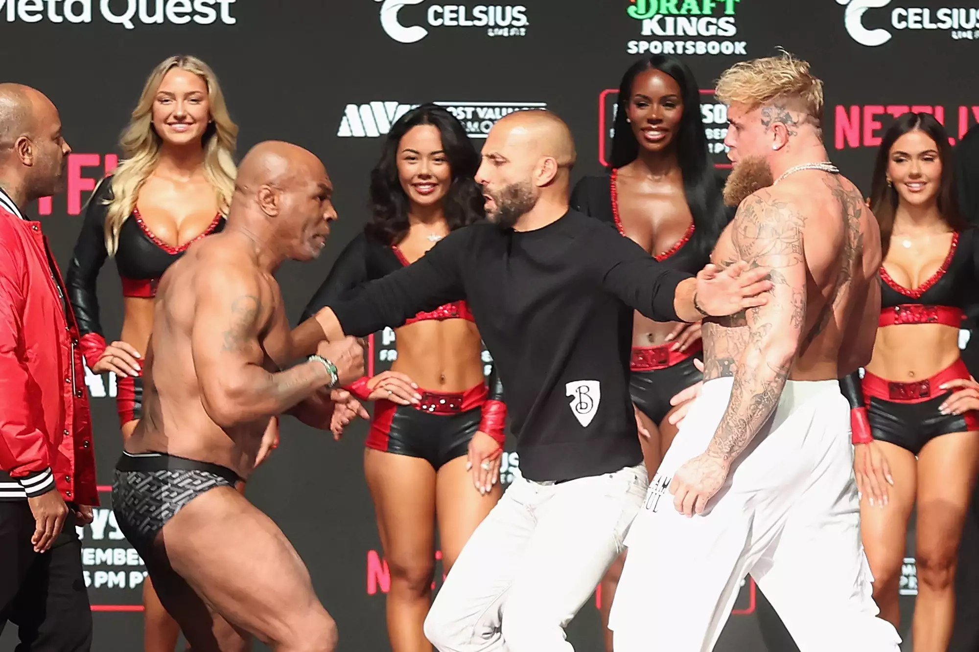  Mike Tyson and Jake Paul are separated as they face off during their ceremonial weigh-in at The Pavilion at Toyota Music Factory on November 14, 2024 in Irving, Texas. The two are scheduled to meet in a heavyweight bout on November 15 at AT&T Stadium in Arlington, Texas. 