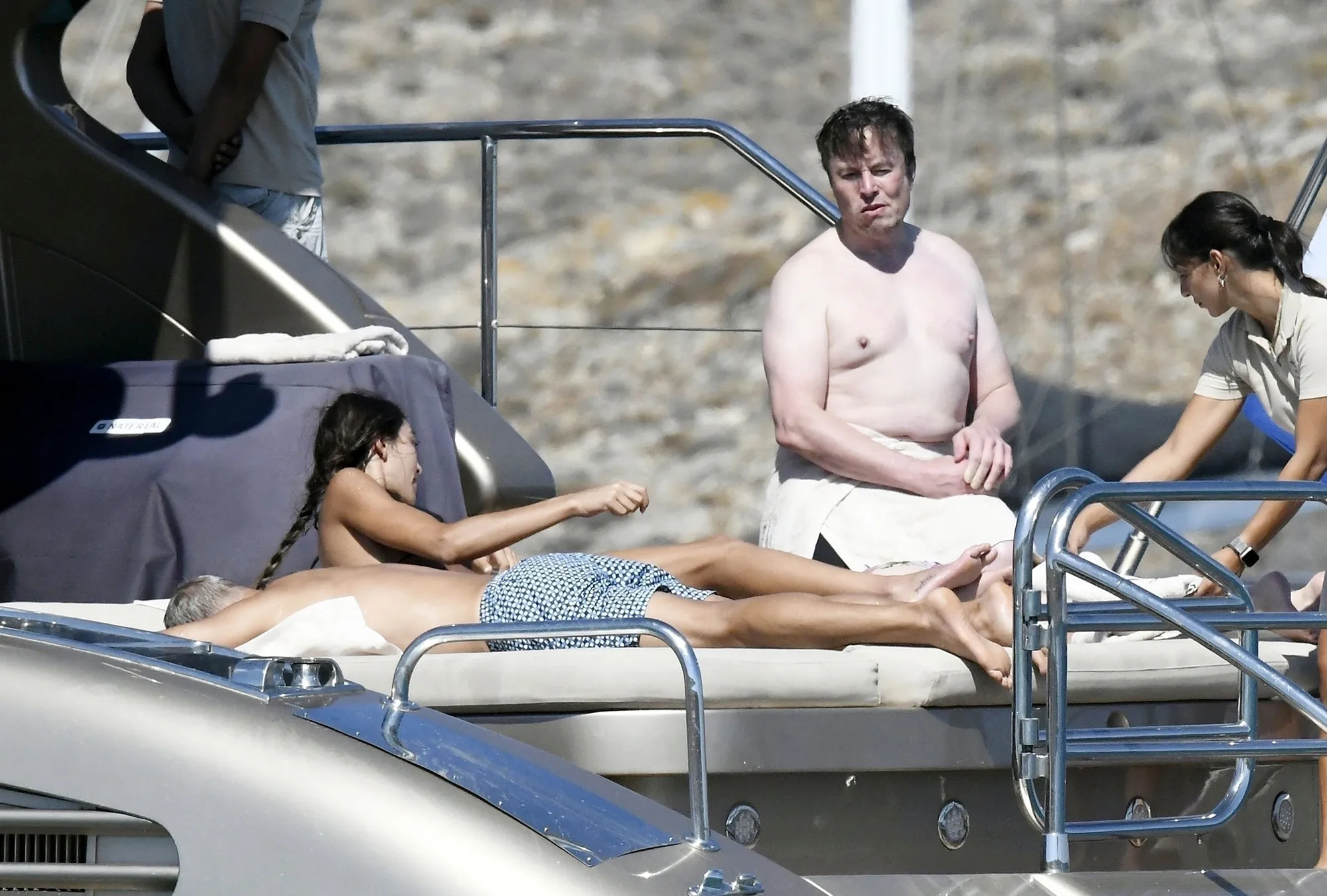 Shirtless Elon Musk on a luxury yacht