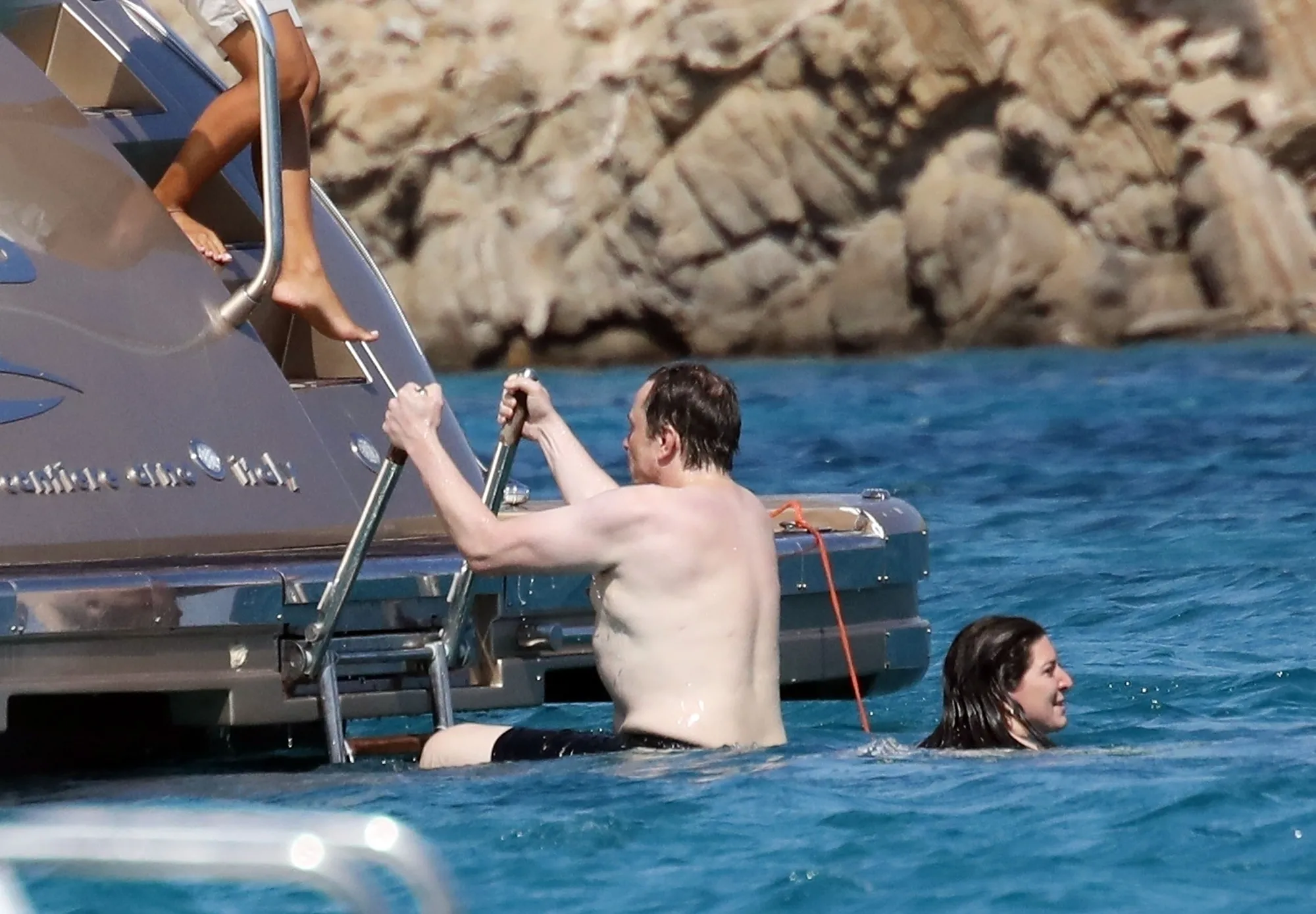 Shirtless Elon Musk on a luxury yacht