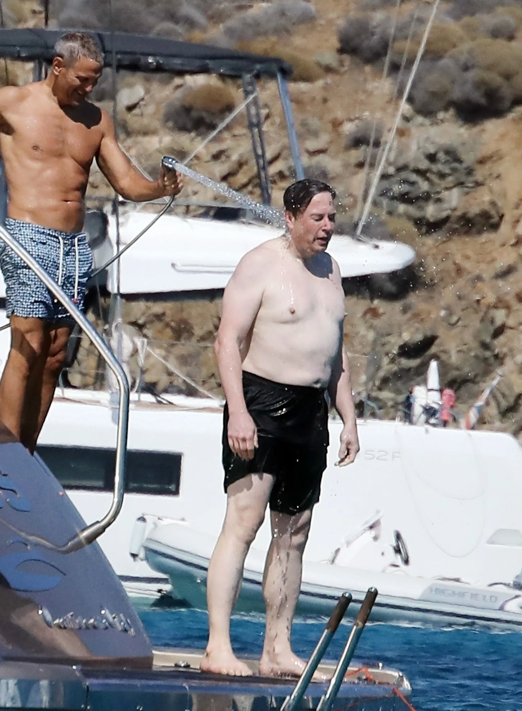 Shirtless Elon Musk on a luxury yacht