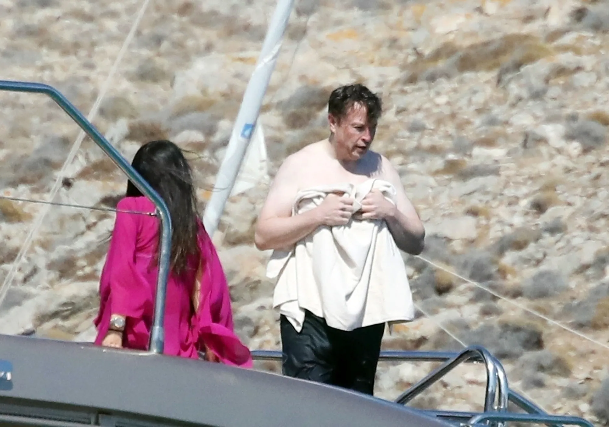 Shirtless Elon Musk on a luxury yacht