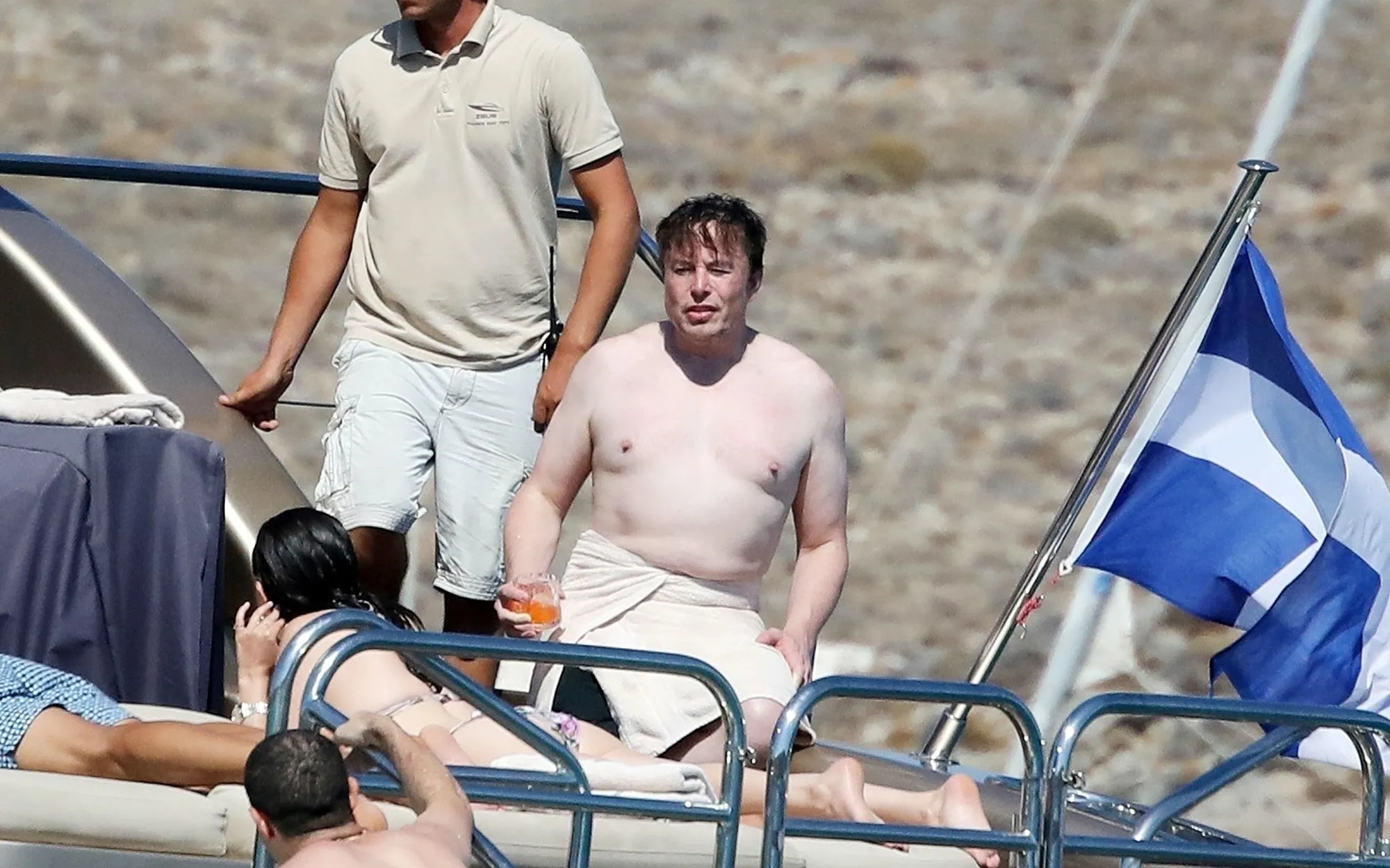 Shirtless Elon Musk on a luxury yacht