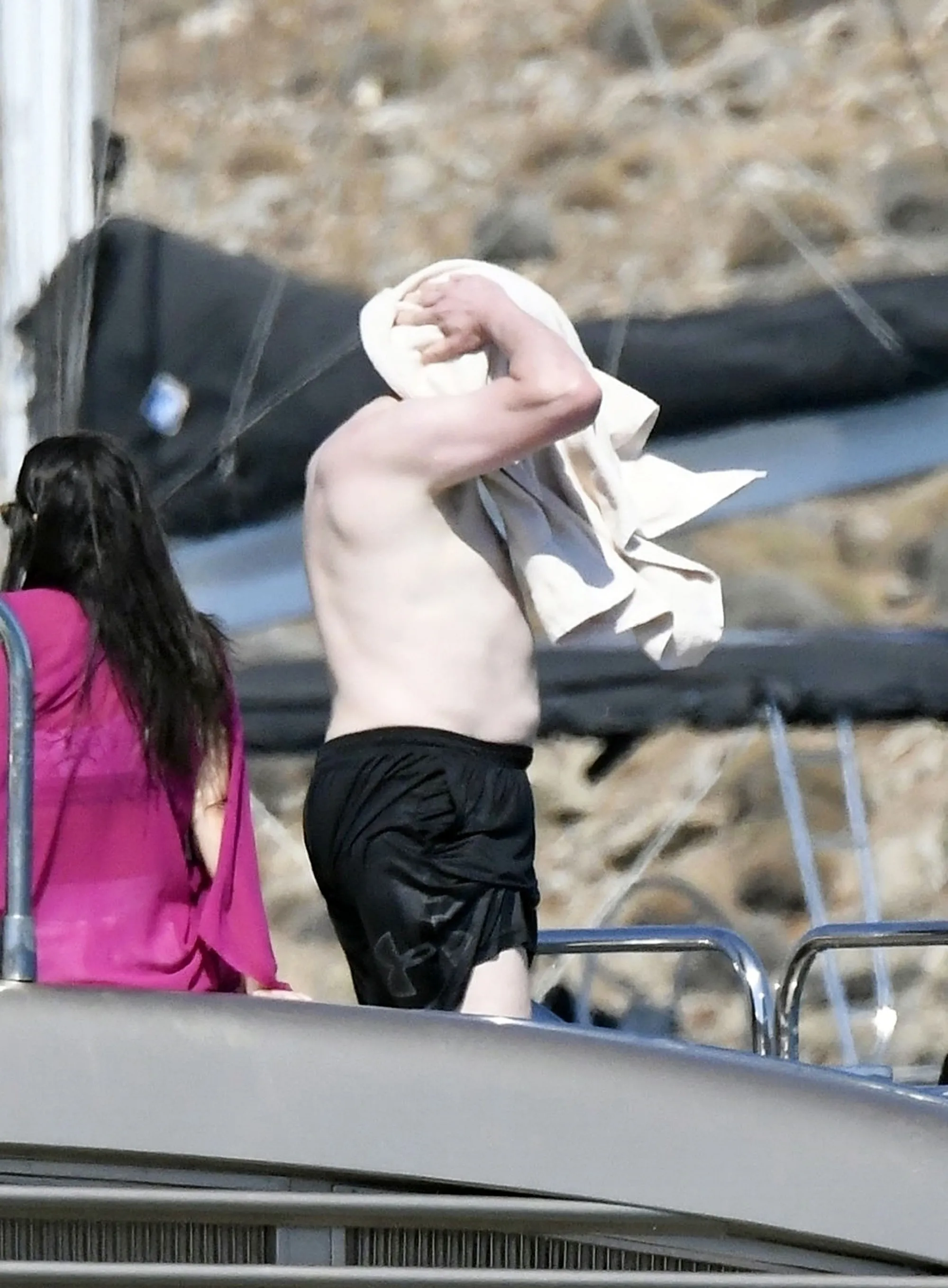 Shirtless Elon Musk on a luxury yacht