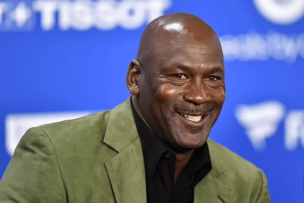 Michael Jordan Sparks Controversy with Call for Medal Removal from Athletes Kneeling During Anthem.