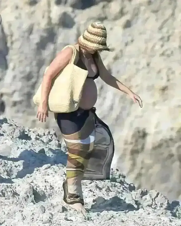 Margot Robbie showcasing her baby bump while on vacation in Italy last year with her husband Tom Ackerley..... 2 Margot Robbie showcasing her baby bump while on vacation in Italy last year with her husband Tom Ackerley.....