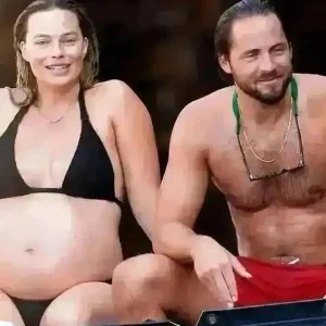 Margot Robbie showcasing her baby bump while on vacation in Italy last year with her husband Tom Ackerley..... 1 Margot Robbie showcasing her baby bump while on vacation in Italy last year with her husband Tom Ackerley.....
